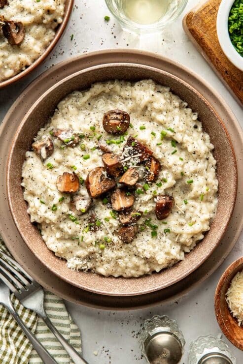 Creamy mushroom risotto finished with truffle, parmesan and chives, served with a glass of white wine