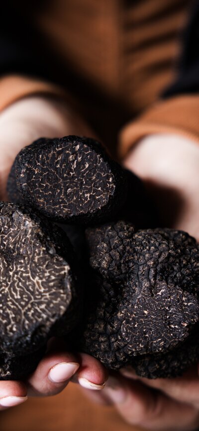 Freshly cooked pasta being finished with a spoonful of TRUFFLITA truffle sauce